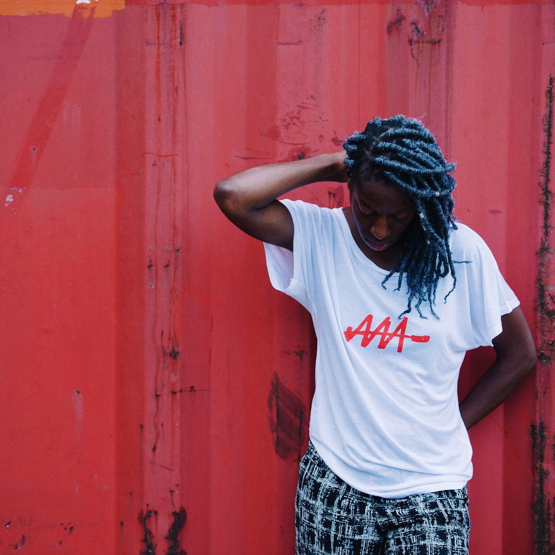 Black woman wears Audio Architect Apparel t-shirt